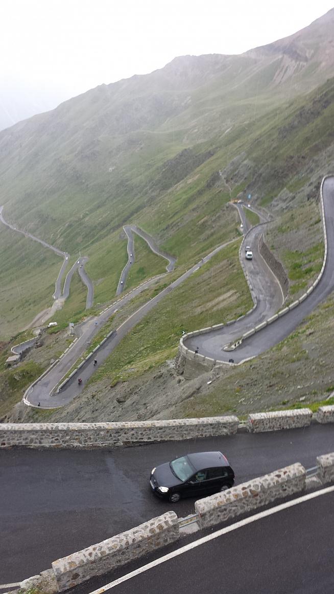 View down the Stelvio Pass from the northern side in the rain in August 2013.