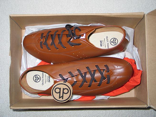 A pair of Quoc Pham fixed shoes in their box