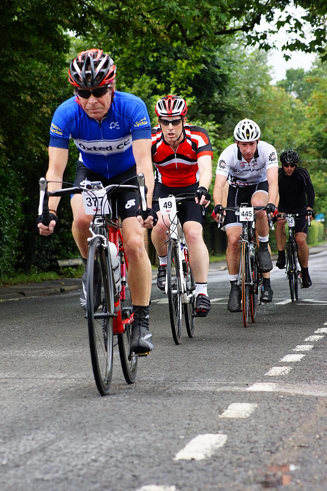 Tuck in  chaps! Oxted CC takes a pull at the front. Photo: randrphotos.co.uk