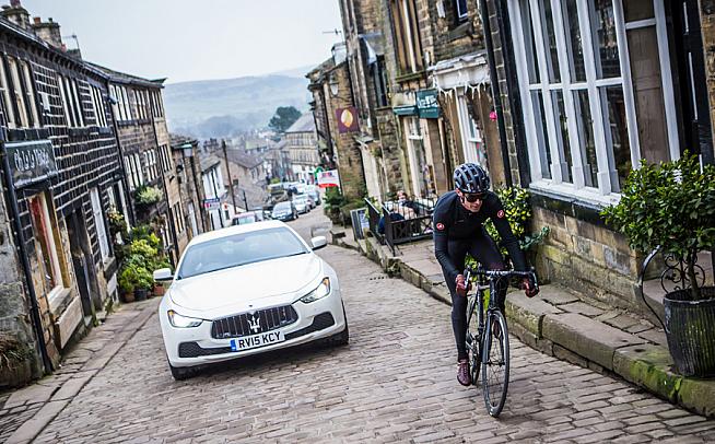 Mind that neutral service car... David Millar tackles Haworth High Street ahead of the Maserati Tour de Yorkshire Ride sportive. Photo: Alex Whitehead