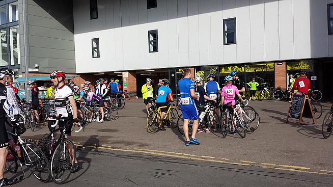 Cyclists line up outside Carrow Road on a Bank Holiday Monday morning.