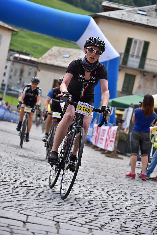 Riding through the cobbled streets of Bormio.