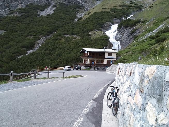 A hairpin and waterfall on the Stelvio.
