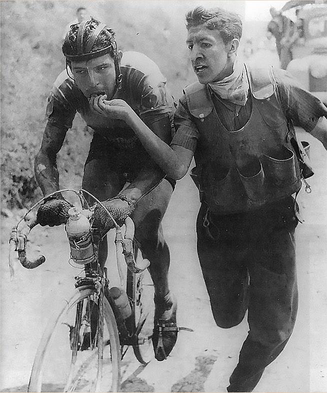 Colombian rider Ricardo Ovalle being fed bocadillo during the Vuelta a Colombia in the early 60s.