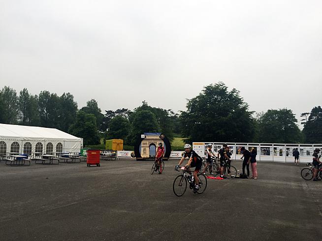 A quiet event village at the start of the Dragon Ride .