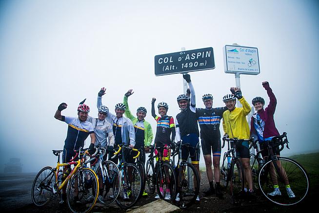 Le Loop riders atop Col d'Aspin. You don't see pro racers stopping for photos.