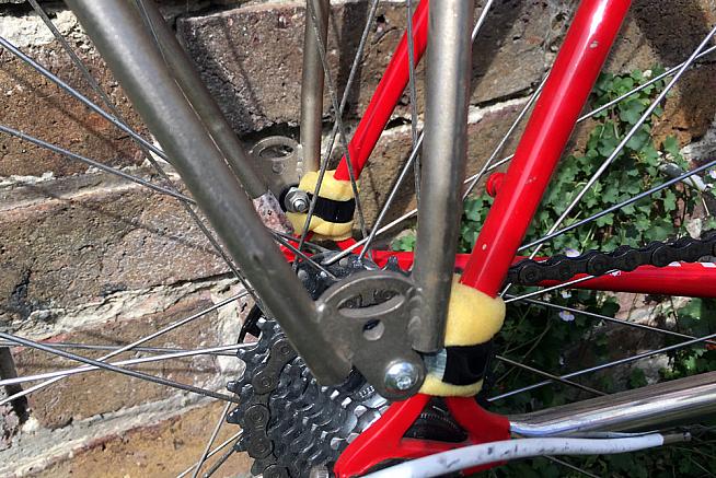 P-clips and sponge will do in a pinch if your bike doesn't have rack mounts.