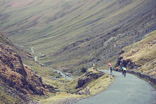 Riders are dwarfed by the landscape on the Fred Whitton Challenge. Photo: Saddleback