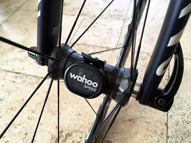 The sensor straps onto your wheel hub to offer speed and cadence data even when the Mini isn't paired to a phone.