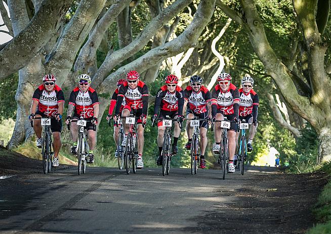 Riders pass through The Dark Hedges made famous by Game of Thrones.