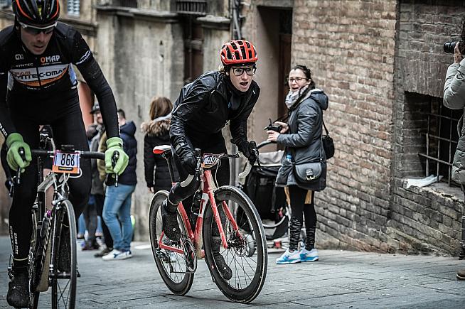 Emmie tackles the Strade Bianche's final climb in the streets of Siena. Photo: Sportograf