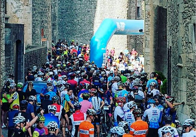 Riders mass for the start at the Girona Granfondo.