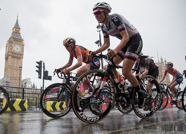 Riders pass Big Ben approaching the final bend of the RideLondon course.