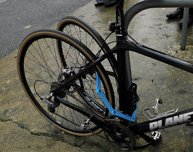 It's possible to lock both wheels to some bike racks.