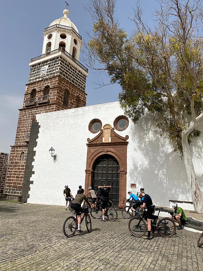 Riders convene in Teguise for a pre-race loop of Lanzarote by daylight.