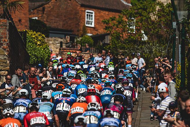 The bunch launches into another cobbled ascent on the Rapha Lincoln GP.