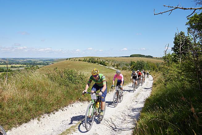 Enjoying another dusty climb in the sunshine. Photo Michael Blann