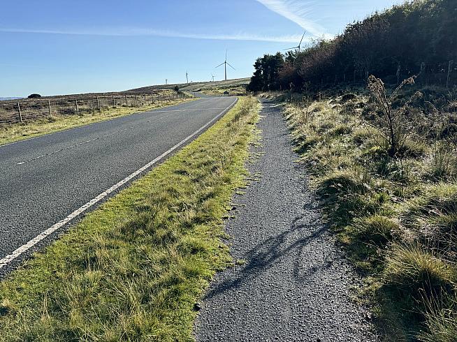 The course briefly adjoins the road.